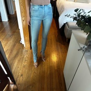 Weworewhat light wash split hem jeans. Size 28. High waisted.